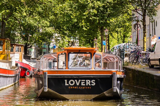 Amsterdam 1h Canal Cruise by Semi-Open Boat with Audio Guide - Red Light District views plus the Skinny Bridge moment