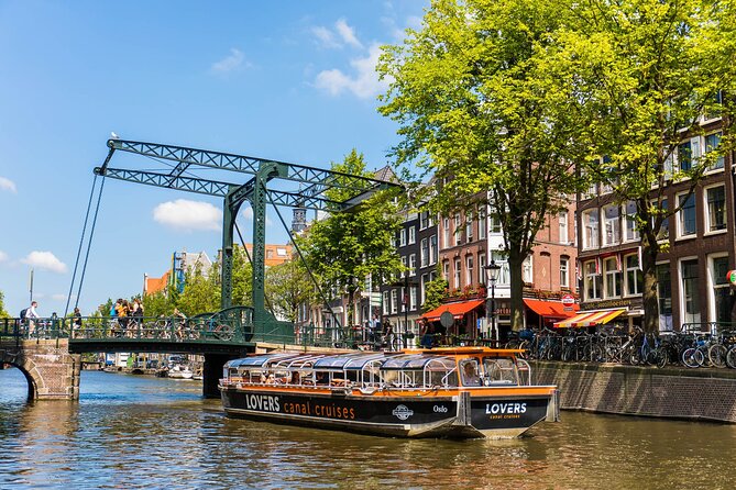 Amsterdam 1h Canal Cruise by Semi-Open Boat with Audio Guide - The 1-hour canal cruise route: bridges, towers, and canals