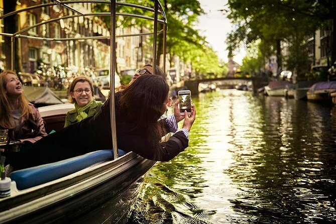 Amsterdam 2-hour Private Canal Cruise with Live Guide and Drinks - A private cruise where Amsterdam slows down fast