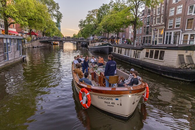 Amsterdam 2 Hour Small-Group Canal Cruise with Dutch Snacks & Bar - Anne Frank House from the water, plus Westerkerk nearby