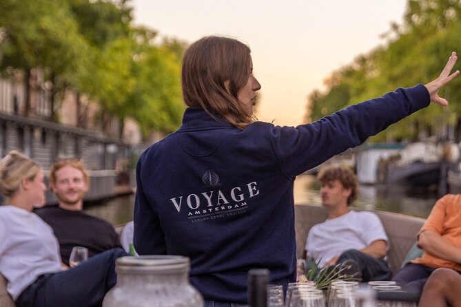Amsterdam 2 Hour Small-Group Canal Cruise with Dutch Snacks & Bar - Down the Amstel to Magere Brug: where romance meets real city life