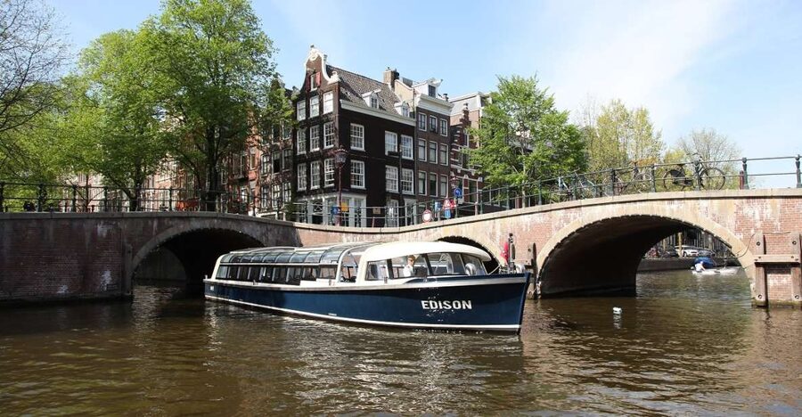 Amsterdam: 75 Minute City Canal Cruise with Audio Guide - Anne Frank House, Iconic Bridges, and the UNESCO Canal Commentary