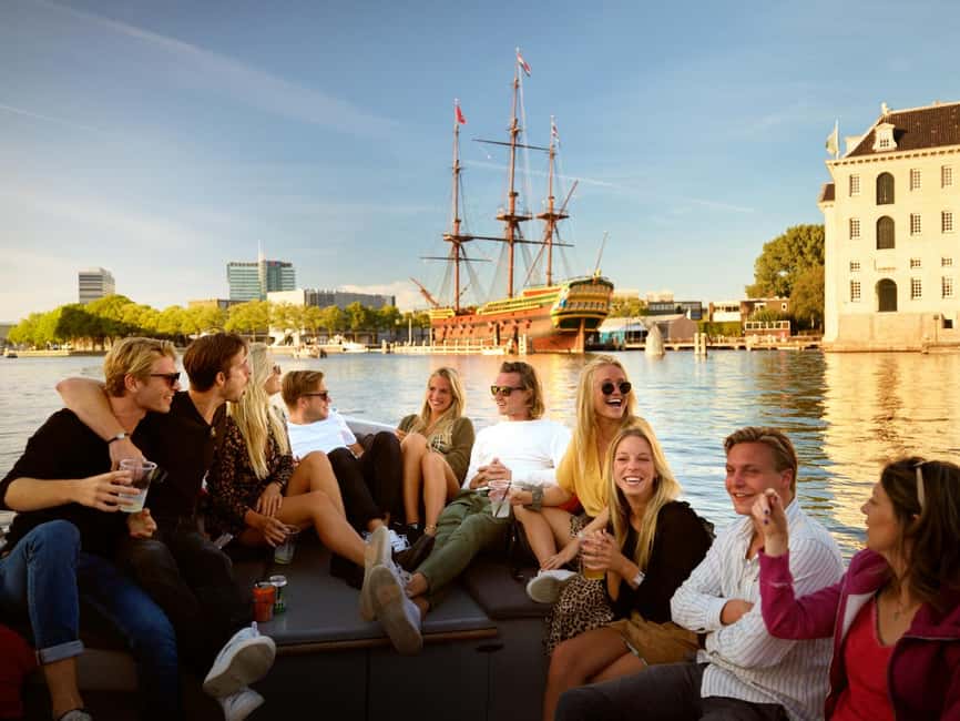 Amsterdam: 90 min Cruise with Local Guide & Unlimited Drinks - Electric open boat, small group, real Amsterdam views