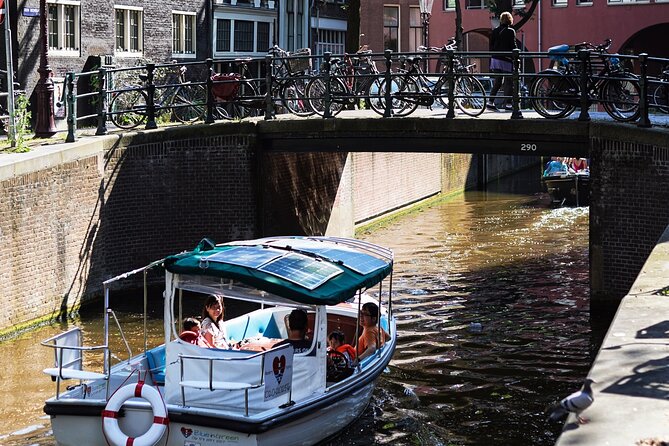 Amsterdam 90-min Private Canal Cruise with Live Guide and Drinks - Amstel and the old-and-new mix