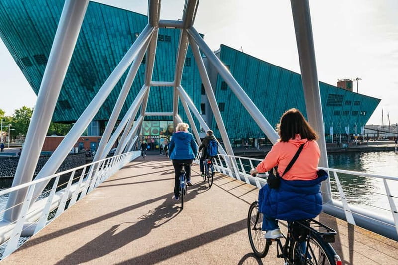Amsterdam Bike Tour in Small Group + Optional Canal Cruise - The Jordaan: narrow streets, canal edges, and an Amsterdam mood shift