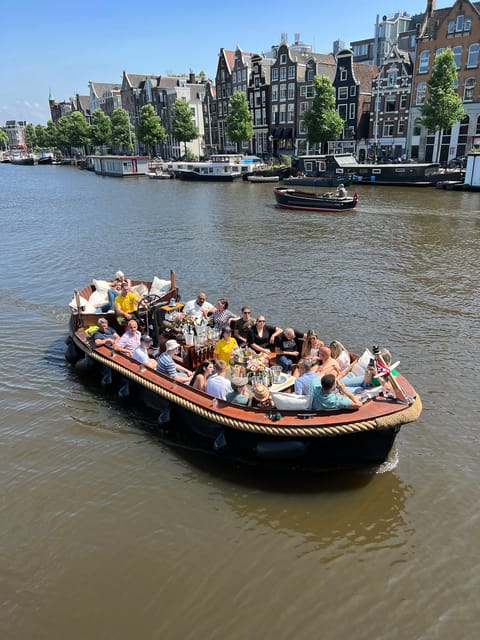 Amsterdam: Boat Tour with Optional Unlimited Drinks - What to wear and bring for comfort, photos, and hearing the guide