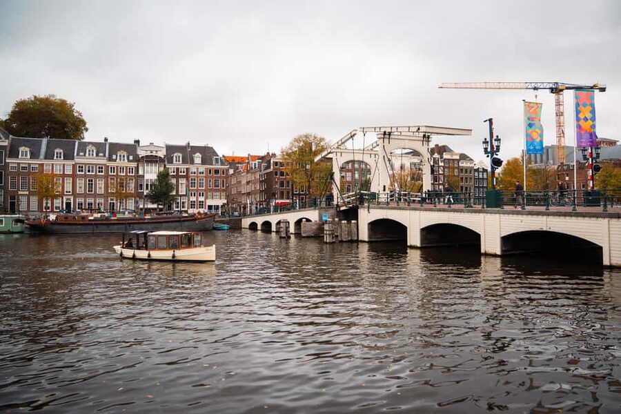 Amsterdam Canal Boat Tour with Live Guide - The Cozy Boat Setup: Open Roof, Heating, and a Real Restroom