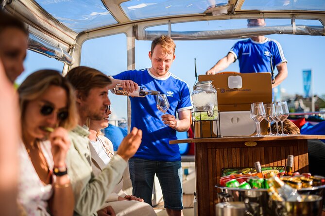 Amsterdam: Canal Booze Cruise with Unlimited Drinks Option - Amstel river, Skinny Bridge, and the “7 Bridges” view