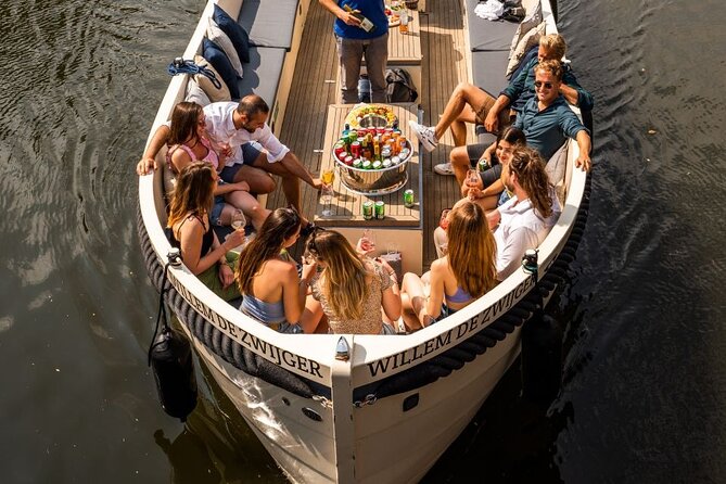 Amsterdam: Canal Booze Cruise with Unlimited Drinks Option - Amsterdam Light Festival stop: art viewing with a time box