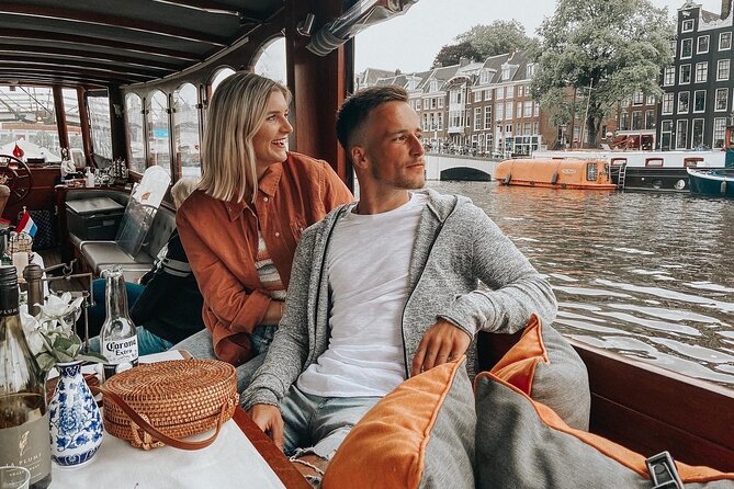 Amsterdam Canal Cruise in Classic Salon Boat With Drinks and Cheese - The guides in orange: what the commentary adds