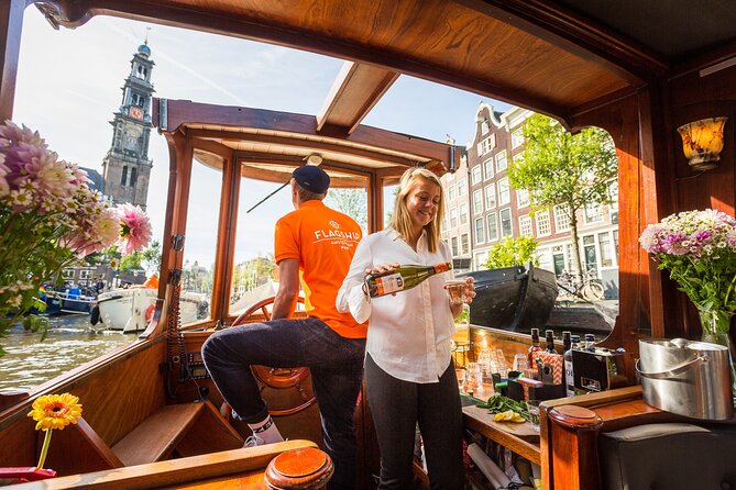 Amsterdam Canal Cruise in Classic Salon Boat With Drinks and Cheese - Boarding a classic salon boat, plus the step you should plan for