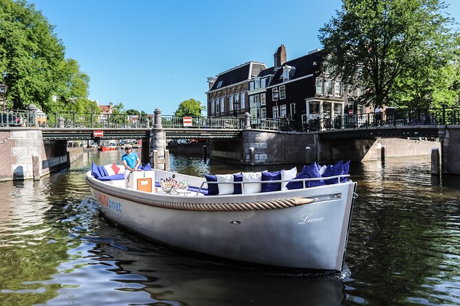 Amsterdam Canal Cruise in Open Boat with Unlimited Drinks Option - Unlimited drinks option, coolers, and toast expectations