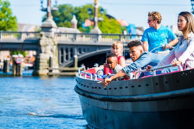 Amsterdam Canal Cruise in Open Boat with Unlimited Drinks Option - Comfort in cold or light rain, plus seating tips