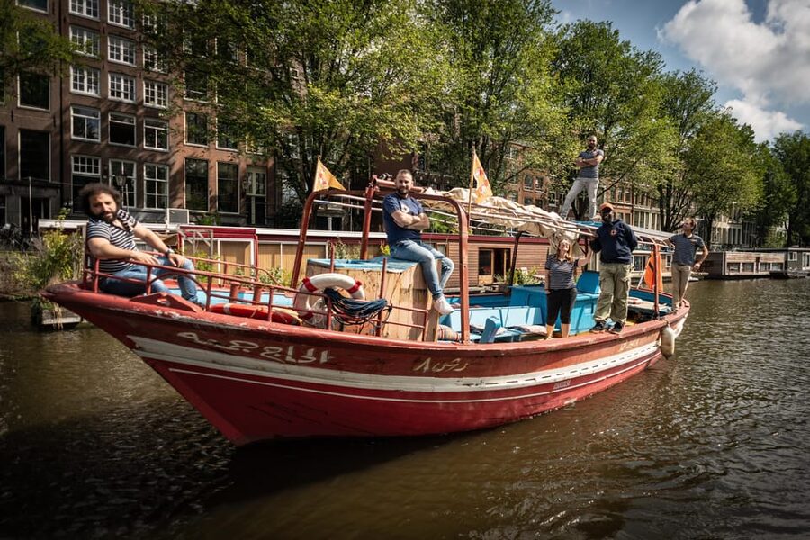 Amsterdam: Canal Cruise on a Wooden Refugee Boat - Practical sailing tips: weather, snacks, and how to get more out of Q&A