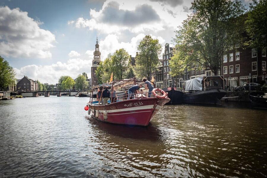 Amsterdam: Canal Cruise on a Wooden Refugee Boat - Price and value for a $41, 1.5-hour canal experience