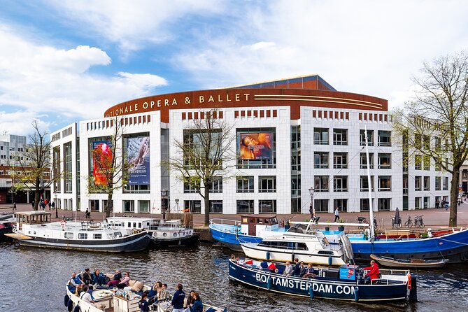 Amsterdam Canal Cruise with Live Guide - Central Station - Weather-proof cruising: open in summer, covered in cooler seasons, heated in winter