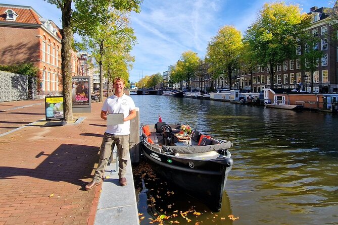 Amsterdam Canal Tour by Open Boat – 90 min Small Group Experience - Kolksluis and 17th- and 18th-century warehouses: a canal that still works
