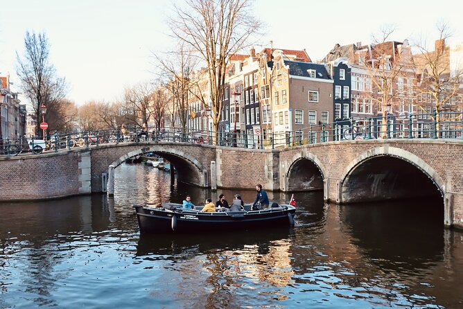 Amsterdam Canal Tour by Open Boat – 90 min Small Group Experience - Nieuwmarkt and De Waag: the city gate that kept changing jobs