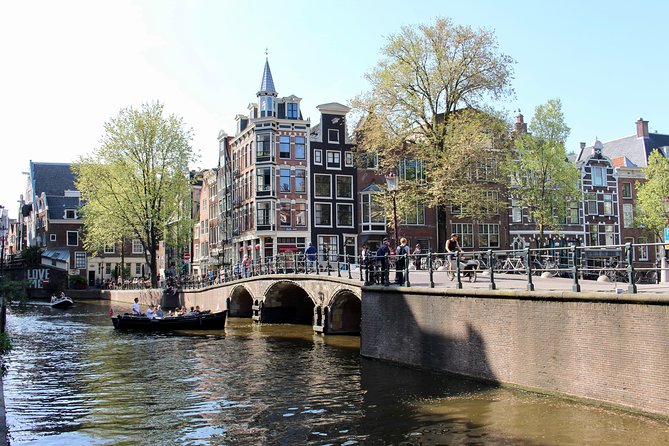Amsterdam Canal Tour by Open Boat – 90 min Small Group Experience - The canal belt classics: Geldersekade to Herengracht and Seven Bridges views
