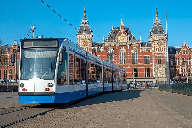 Amsterdam Center: City Walk Audio Guide in 7 Languages on Phone - Ships Chandlers stained glass and the Trippenhuis story
