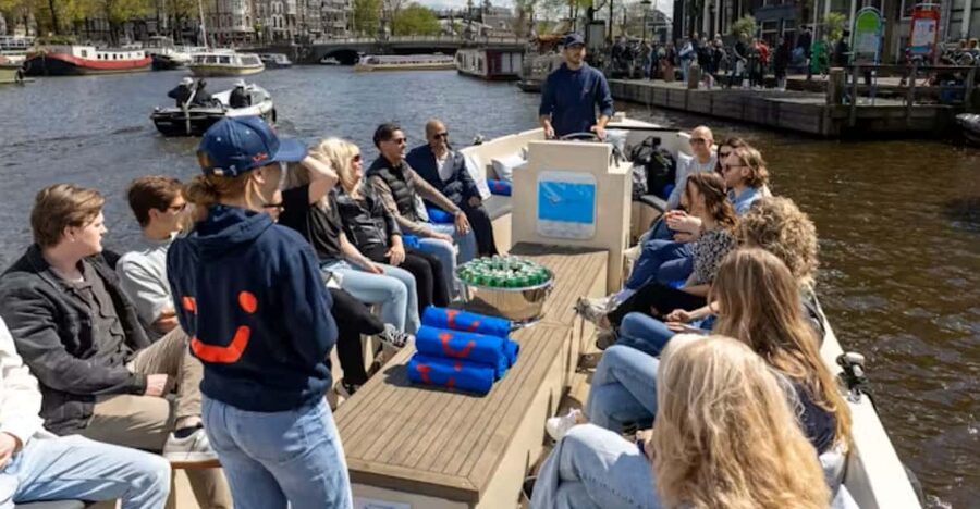 Amsterdam: City Highlights Small Boat Canal Cruise with host - Entering the canal groove from Rembrandtplein