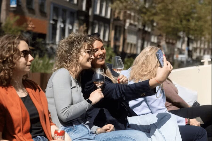 Amsterdam: City Highlights Small Boat Canal Cruise with host - Chinatown and Central Station, plus Oosterdokseiland’s modern edge