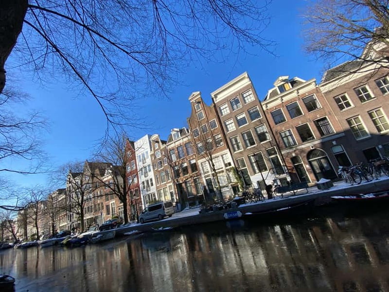 Amsterdam: City Tour in German - Small group pacing that makes room for real questions