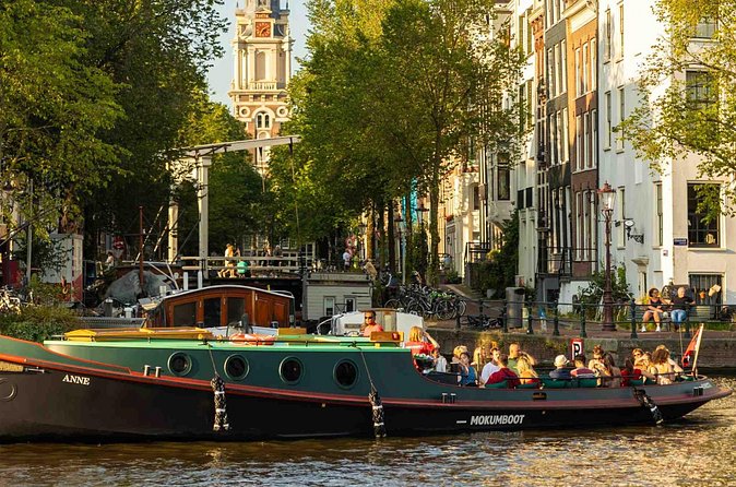 Amsterdam Classic Canal Cruise on a Historic Tugboat - Amstel River Vistas and the Church Tower in the Distance