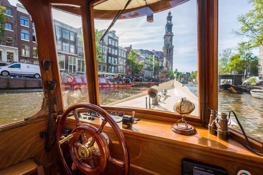 Amsterdam: Classic Saloon Boat Cruise with Cheese & Wine - The route: from the Maritime Museum to the Skinny Bridge