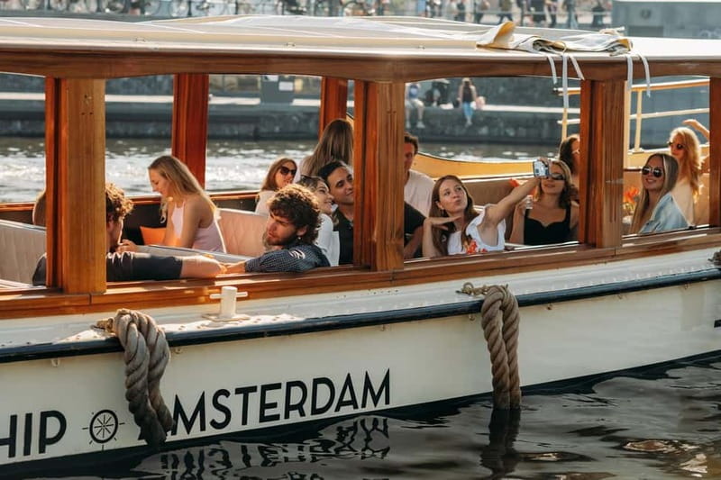 Amsterdam: Classic Saloon Boat Cruise with Cheese & Wine - Timing and comfort: what to expect when weather turns