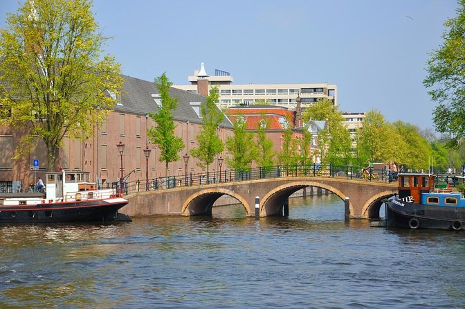 Amsterdam Classic Saloon Boat Cruise with Drinks and Cheese - Covered Comfort on a Wooden Saloon Boat, Plus Why That Matters