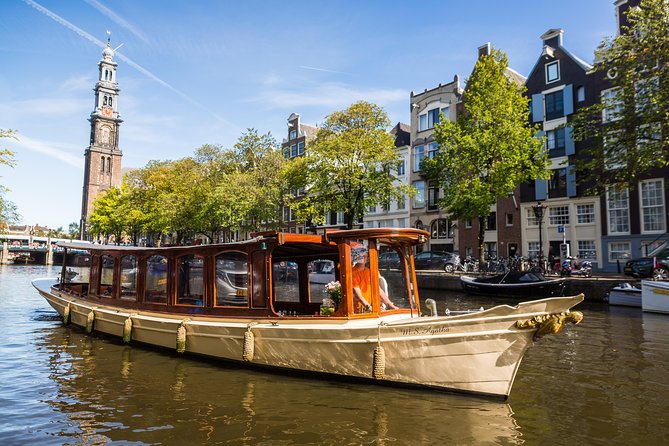 Amsterdam Classic Saloon Boat Cruise with Drinks and Cheese - Getting On Board: Meeting Point, Seating Reality, and the Step Up