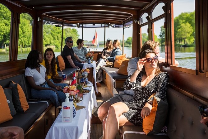 Amsterdam Classic Saloon Boat Cruise with Drinks and Cheese - Rijksmuseum, Amstel, and the Canal Belt Logic Behind the UNESCO Ring