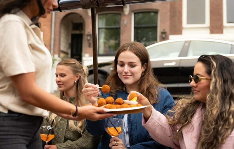 Amsterdam: Covered Heated Canal Cruise with Bitterballen - The guide experience: stories, tips, and the local touch