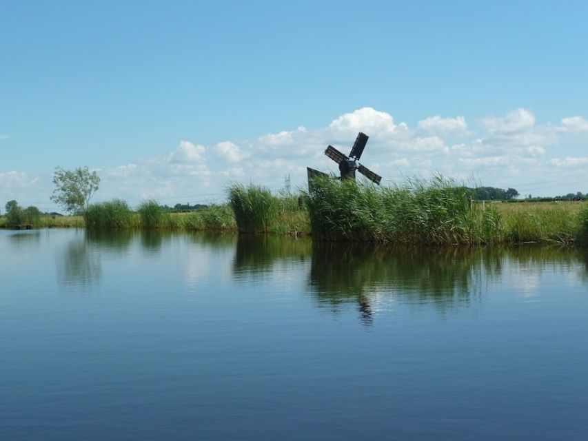 Amsterdam: Dutch Countryside Sunset Canoe Tour - Paddling through polders, farmhouses, mills, and birds