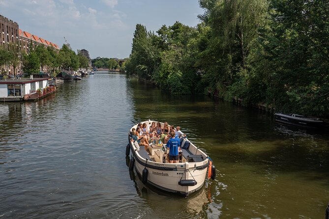 Amsterdam: Evening Candle Light Cruise With Wine & Cheese - The Route: From Red Light District Views to the Seven Bridges Moment