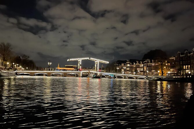 Amsterdam Evening Cosy & Small Cruise & Drinks and Bites - Sunset - Open boat practical tips: steps, cold water, rain cover, and no bathroom