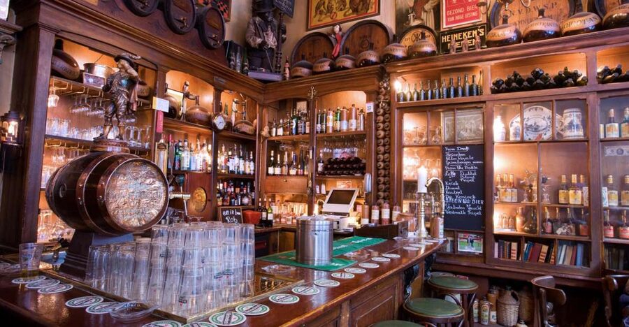 Amsterdam: Exclusive Red Light District Tour and Drink - Where the Walk Starts: Damrak to Prins Hendrikkade