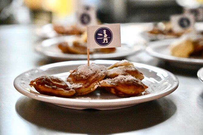 Amsterdam Food Tour of 10+ Local Classic Tastings in Jordaan Area - Westertoren and key memorial stops, with food always close at hand