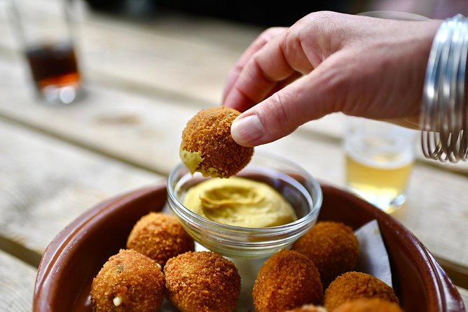 Amsterdam Food Tour of 10+ Local Classic Tastings in Jordaan Area - The fishmonger chapter: herring and kibbeling