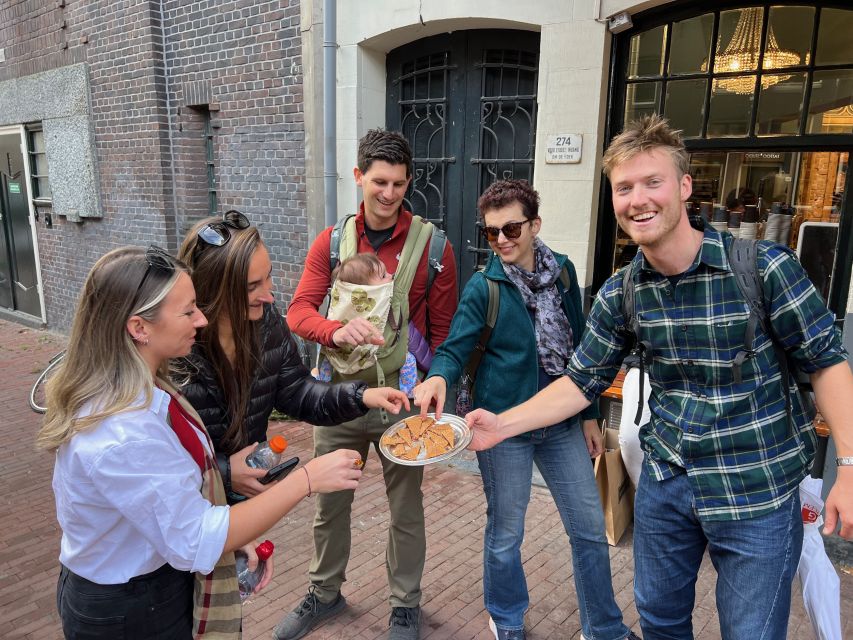 Amsterdam: Food Tour with Drinks by Spui, Canals and Jordaan - A wine tasting stop that keeps the walk moving