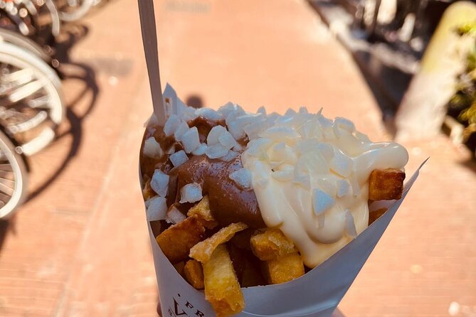 Amsterdam Food Tour with Full Meal & Drinks by Do Eat Better - Bloemenmarkt cheese tasting: flowers on the Singel, dairy on your plate