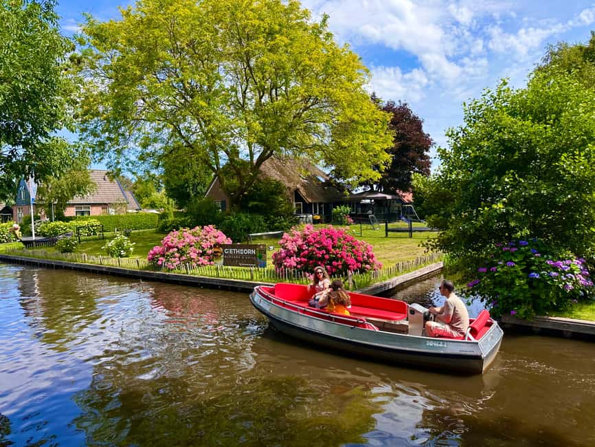 Amsterdam: Giethoorn Day Trip, with several guided options - The Giethoorn canal cruise: photos, bridges, and skipper storytelling