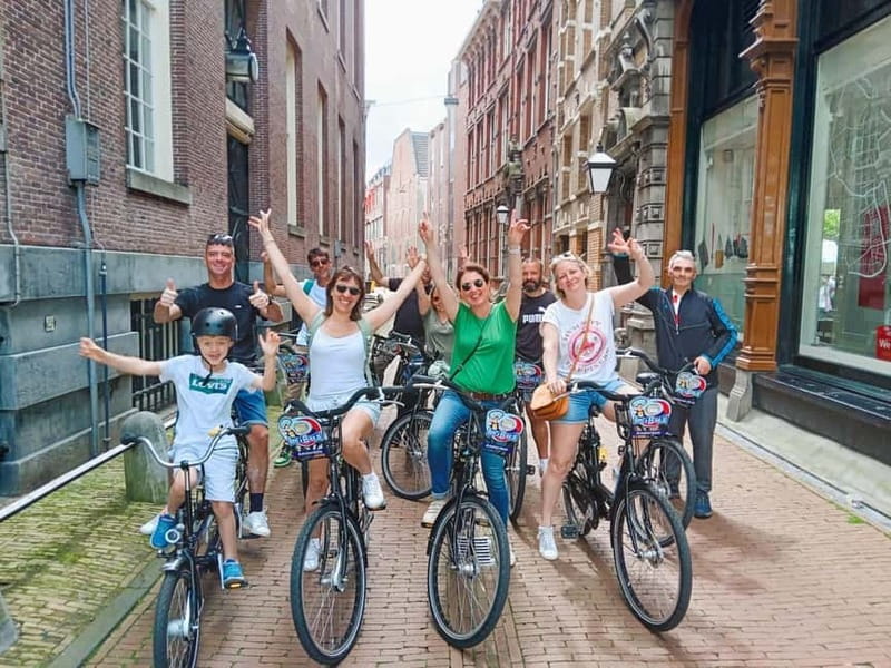 Amsterdam: Guided bike tour in French off the beaten track - Jordaan First: Village-Style Streets, Canals, and Slow City Mood