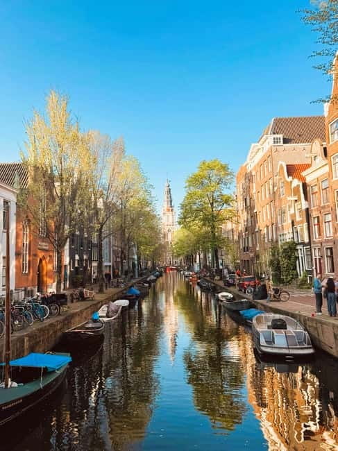 Amsterdam: Guided bike tour in French off the beaten track - Nieuwmarkt Square to Entrepotdok: Getting Oriented Before the Story Turns