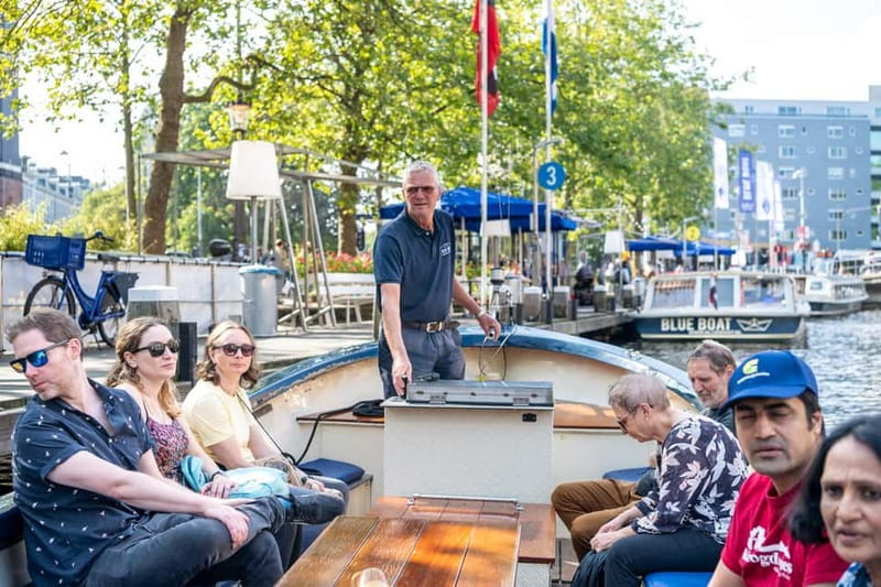 Amsterdam: Guided City Highlights Open Boat Canal Cruise - Key highlights worth planning around
