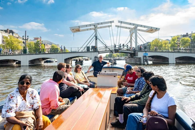 Amsterdam: Guided City Highlights Open Boat Canal Cruise - From Hard Rock Cafe to Holland Casino: Your First Real Glimpse of the Route