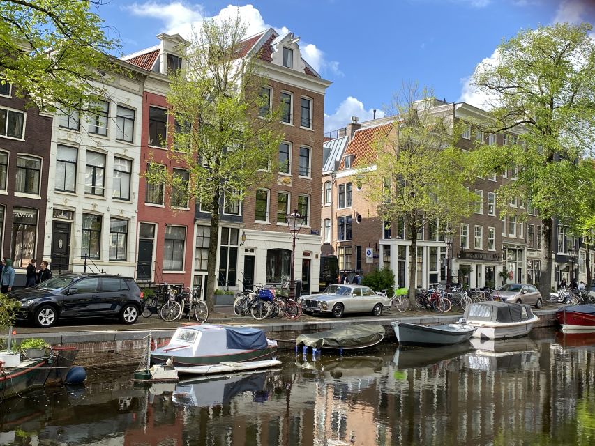 Amsterdam: Guided Off-The-Beaten-Track Walking Tour - Meeting at Beursplein, then getting the Dam Square story in order
