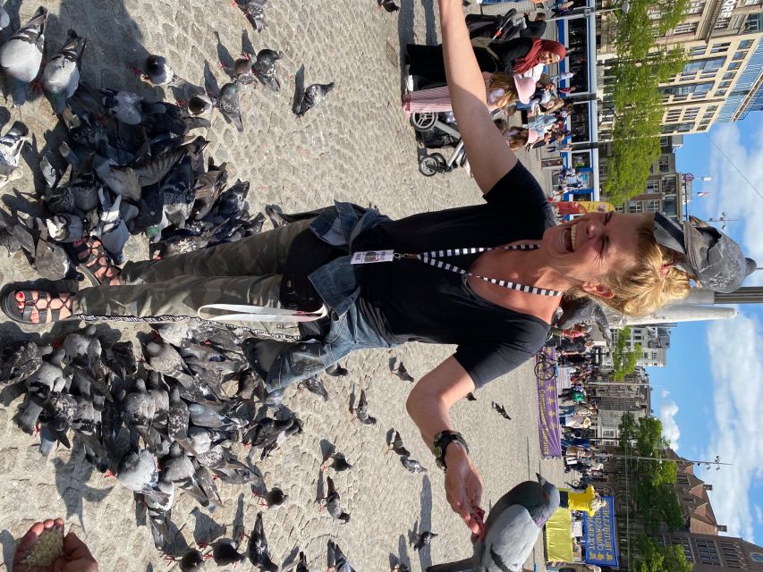 Amsterdam: Guided Off-The-Beaten-Track Walking Tour - Torensluis and the canal belt lesson you will remember later