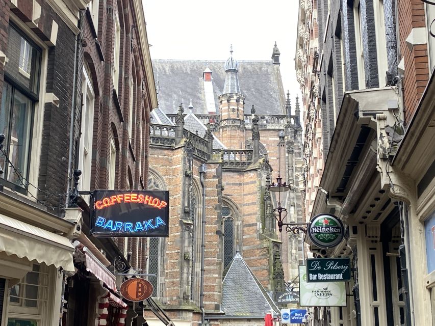 Amsterdam: Guided Off-The-Beaten-Track Walking Tour - Dam Square stops: Royal Palace, National Monument, and Nieuwe Kerk